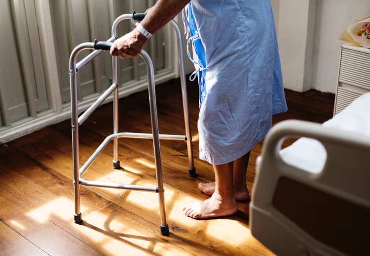 Older adult using a walker at home